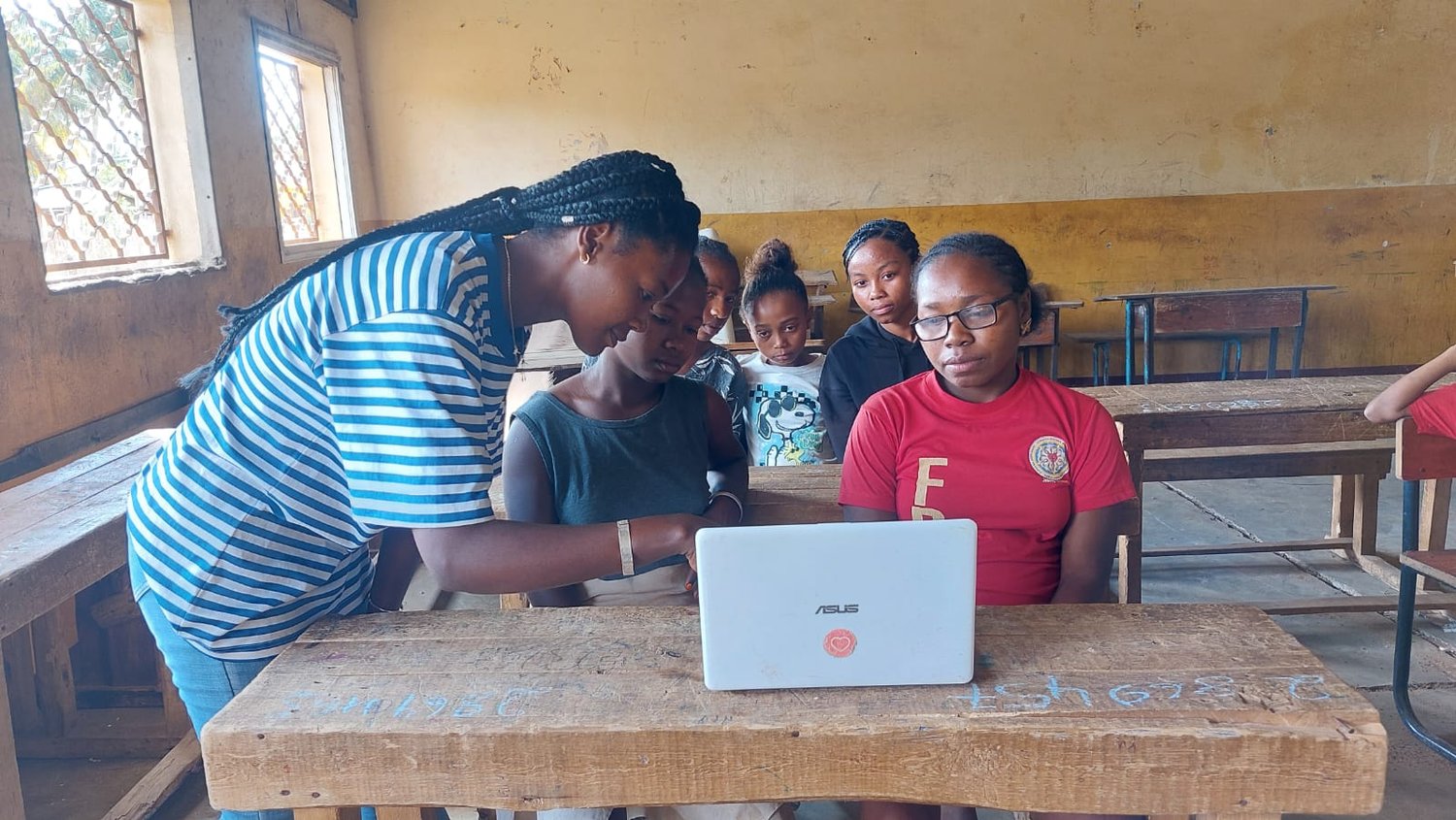 Young women learning with a computer in Ambovombe, Southern Madagascar.